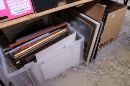 A quantity of paintings and prints.