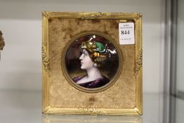 A good Limoges small circular enamel portrait plaque of a lady in a gilt frame.