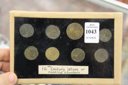 A group of eight 16th century jetons or casting counters (tokens).