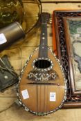 A mandolin with mother-of-pearl inlaid decoration.