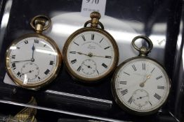 A silver pocket watch and two gilt metal pocket watches.