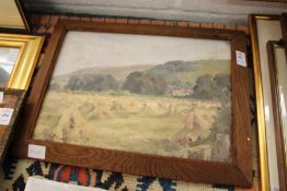 A small Impressionist style oil depicting stooks of wheat in a field, oil on board.