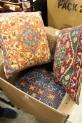 A quantity of embroidered cushions.