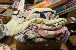 A collection of patchwork quilts.