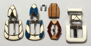 A group of enamel buckles.