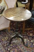 A 19th century oak circular tripod table.