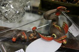 A Herend fish shaped place name holder and two similar items.