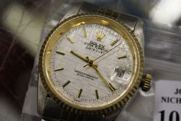 A gent's stainless steel wristwatch.