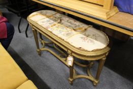 A gilt framed long stool or window seat.