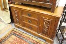 A late Victorian oak sideboard.