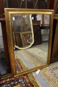 A pair of modern rectangular gilt framed wall mirrors.
