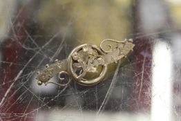 A silver bar brooch.