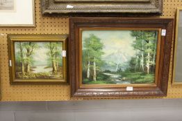 Wooded River Landscape with Mountains Beyond oil on canvas, together with a similar painting.