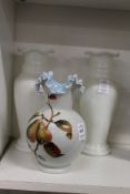 An opaque glass vase with painted decoration and a pair of glass vases.