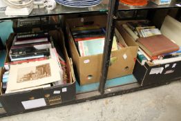 Three boxes of assorted books.