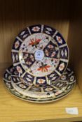 Four Crown Derby plates.