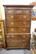 A George III mahogany tallboy with a dentile moulded cornice, three small drawers over six further