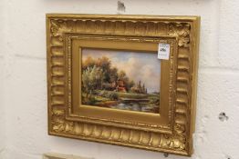 River Landscape oil on board, in a decorative gilt frame.