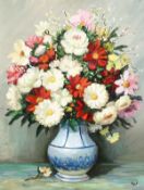 Marcel Dyf (1899-1985) French, a still life of colourful mixed flowers in a blue and white vase, oil
