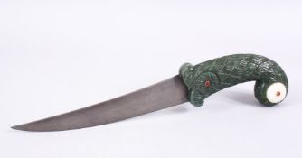 A MUGHAL INDIAN JADE HILTED WATERED STEEL DAGGER, The handle carved in floral style with inset gem