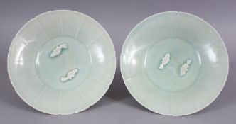 A PAIR OF CHINESE CELADON CARVED PORCELAIN FISH BOWLS, with lobed sections and raised carved details