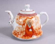 A GOOD CHINESE REPUBLIC STYLE PORCELAIN TEAPOT OF LUOHAN, the figure seated amongst flame, with