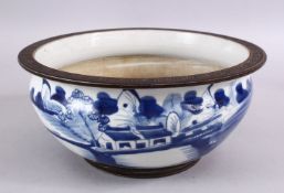 A CHINESE BLUE & WHITE PORCELAIN BOWL , decorated with a fisherman at waterside, 26cm diameter.