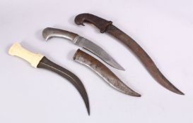 A COLLECTION OF 3 INDO PERSIAN DAGGERS - one with a bone handle, one with a white metal handles