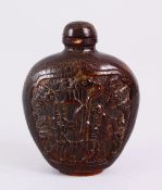 A 19TH CENTURY CHINESE CARVED HORN SNUFF BOTTLE, carved with scenes of an immortal with deer, in
