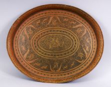 A HEAVY QUALITY CARVED PERSIAN BRASS TRAY, carved with scenes of figures and animals and flora, 43.