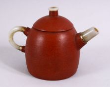 A CHINESE YIXING CLAY TEAPOT MOUNTED WITH A JADE HANDLE, SPOUT AND FINIAL, the base with an