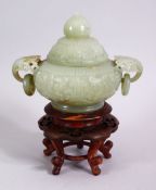 A CHINESE CARVED CELADON JADE TWIN HANDLE CENSER & HARDWOOD STAND, the censer carved with floral
