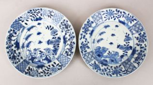 A GOOD PAIR OF 18TH CENTURY CHINESE BLUE & WHITE PORCELAIN PLATES, each with panel decoration