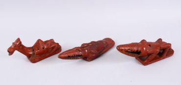 THREE 19TH CENTURY TURKISH TOPHANE POTTERY BATH RASPS, in the form of two alligators20cm, 20cm &