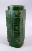 A CHINESE CARVED JADE STYLE ARCHAIC CONG VASE, with carved archaic decoration, 29.5cm high.
