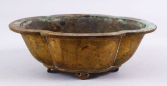 A GOOD 20TH CENTURY CHINESE MOULDED QUAD FOOT BRONZE PLANTER, Of moulded form, upon four feet,