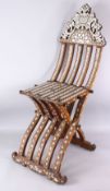 A 19TH CENTURY OR EARLIER ISLAMIC WOOD AND MOTHER OF PEARL FOLDING CHAIR, with inlaid wire and