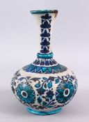 A 19TH CENTURY OR EARLIER PERSIAN POTTERY BOTTLE VASE, decorated with formal floral motif, 25cm, (