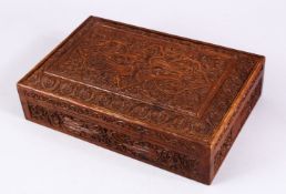 A GOOD 19TH / 20TH CENTURY INDIAN CARVED WOODEN LIDDED BOX, 31cm x 20cm.