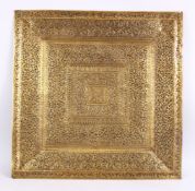 A LARGE 19TH CENTURY SRI LANKAN ENGRAVED BRASS TRAY - Profusely carved with floral decoration 62cm x