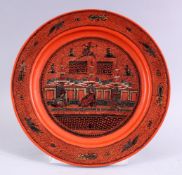 A 19TH / 20TH CENTURY INDIAN LACQUER PLATE, with scenes of figures and buildings, 26cm