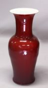 A LARGE CHINESE FLOOR STANDING OX BLOOD RED PORCELAIN VASE, 94cm high