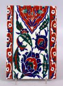 AN UNUSUAL RARE IZNIK POTTERY TILE, with decoration of floral motifs, 24cm x 16cm