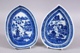 A PAIR OF 18TH CENTURY CHINESE BLUE & WHITE PORCELAIN LEAF SHAPED DISHES, decorated with native