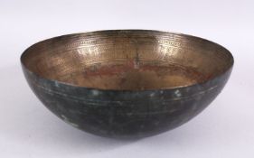 A RARE 9TH / 10TH CENTURY GHAZNAVID PERSIAN BRONZE BOWL, with chased motif decoration, 27cm.
