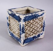 A 19TH / 20TH CENTURY CHINESE BLUE & WHITE PORCELAIN OPENWORK POT, with floral decoration