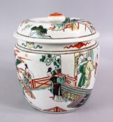 A CHINESE FAMILLE VERTE PORCELAIN JAR AND COVER, decorated with scenes of figures in a balcony