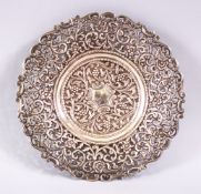 A 19TH CENTURY INDIAN SILVER OPEN WORKED DISH, with formal floral decoration and openwork, 18cm.