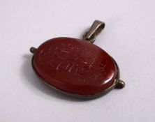 A GOOD ISLAMIC CARVED HARD STONE CALLIGRAPHIC SEAL PENDANT, the stone carved with calligraphy and