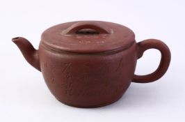 A CHINESE YIXING CLAY CALLIGRAPHY TEA POT, the body of the pot with carved calligraphy, also to